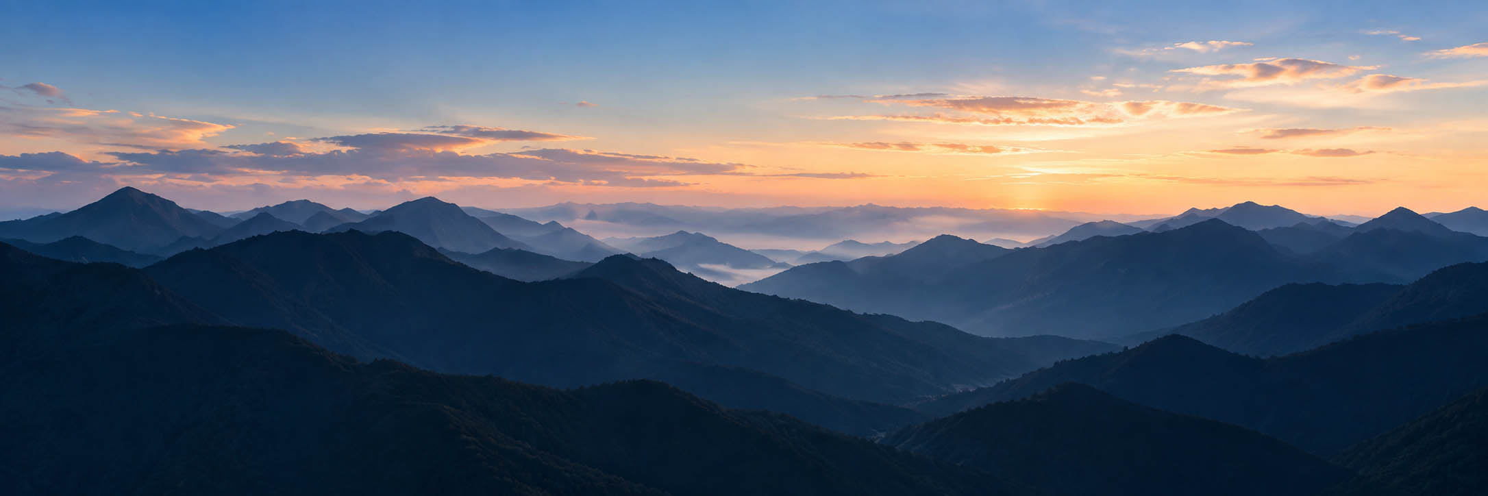 Mountain landscape behind leadership practice cards